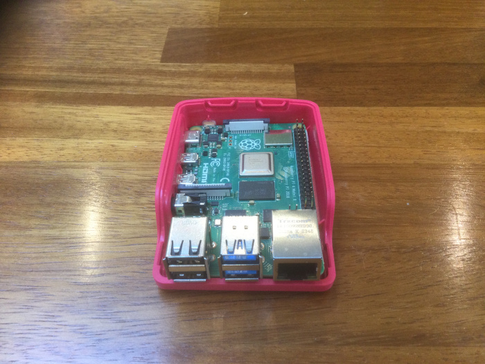 The Raspberry Pi on the base of its case